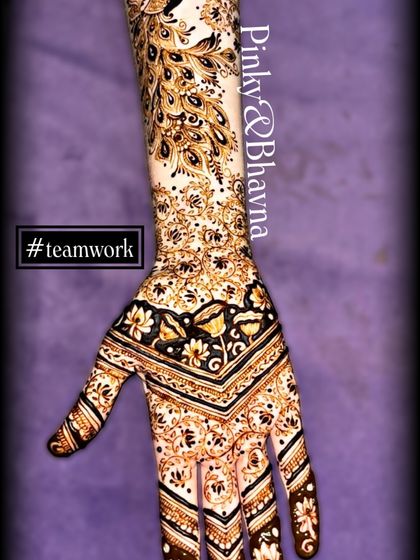 A graceful back-hand design with a peacock feather pattern flowing up the arm. This style is elegant and eye-catching.