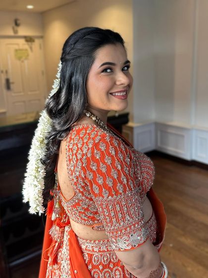 A happy, radiant smile from the mom-to-be. The makeup is designed to be comfortable and long-lasting for her special day.