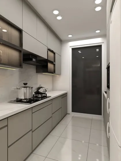 A parallel kitchen layout showing handleless drawers and cabinets with fluted glass details. The design maximizes efficiency in a narrow space while maintaining a sophisticated look.