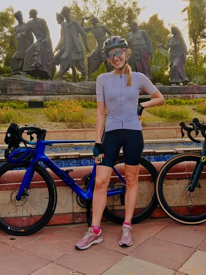 Posing with her Cervelo bike in front of the Gyarah Murti sculpture.