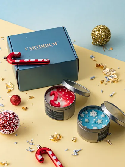 A promotional image for an exhibition at Estella, Juhu, featuring my festive tin candles.