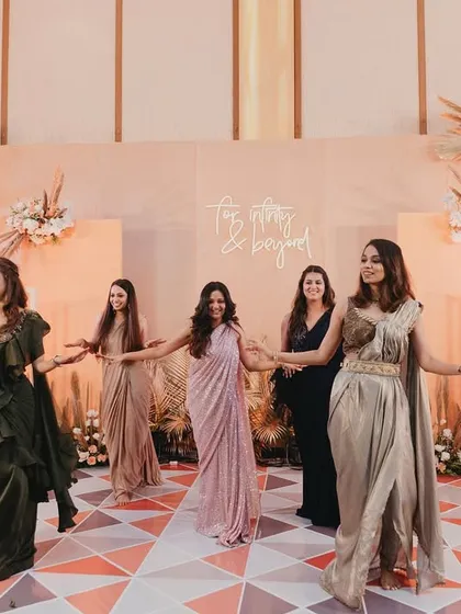 The bride's squad having their moment in front of our chic engagement party backdrop. It was the perfect spot for photos.
