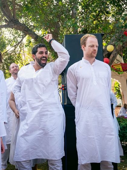 Guests dancing and enjoying the start of a fun-filled Holi party.