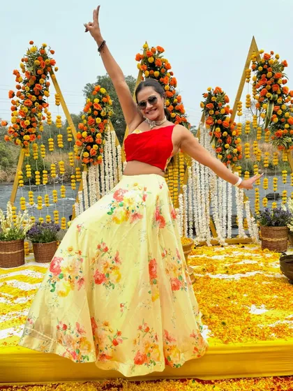 Bringing life and color to a Haldi ceremony. This vibrant floral lehenga and my energetic pose are perfect for capturing the celebratory spirit of Indian weddings.