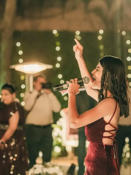 Ready for a glamorous reception night. Whether it's a formal evening or a wild party, I bring the right energy to match the vibe. Here I am, mic in hand, getting the crowd excited and ready to celebrate the happy couple.