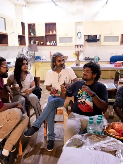 Collaboration is everything. Here I am with the cast and crew, discussing the next scene. Open communication on set ensures everyone is aligned with the creative vision.