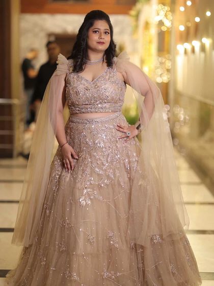 A stunning solo shot of Neelam at her reception. The glamorous makeup and beautiful gown come together for a show-stopping look.