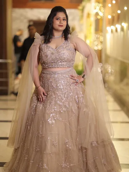 A stunning solo shot of Neelam at her reception. The glamorous makeup and beautiful gown come together for a show-stopping look.