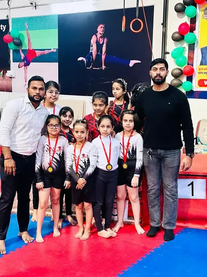 A team of champions. Posing with my students and their well-earned medals after a competition is a moment of great pride. We train hard together and we celebrate our success together.