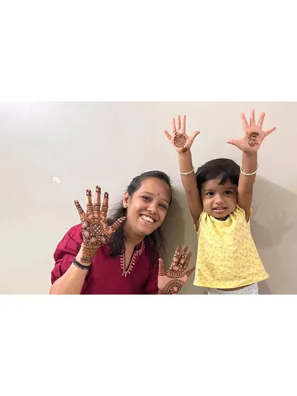 Another adorable shot of my niece showing off her festive mehendi.