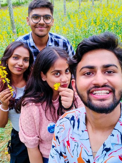 A selfie in a field of yellow flowers during a break at our Rotaract event.