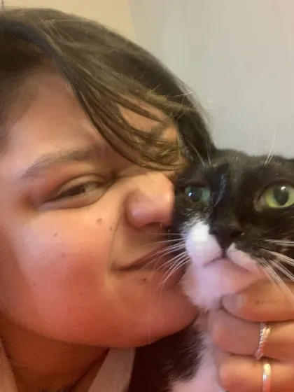 Me and Bailey, just hanging out. Building a personal bond with each cat is the most important part of my job.