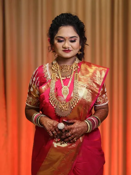 A serene portrait of the bride, her eyes closed, showcasing the soft and beautiful eye makeup.
