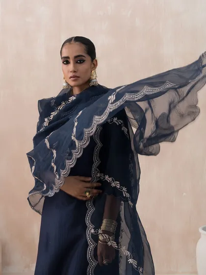 For the 'Firdaus' collection by Saisha, I styled this elegant navy blue suit. The creative direction focused on clean lines and graceful movement, as seen in the flowing organza dupatta, to produce a sophisticated and modern lookbook image.