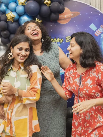 An event is about the people and the connections. I love capturing the adults having just as much fun as the kids, like this moment of shared laughter between friends. It’s all part of the day's story.