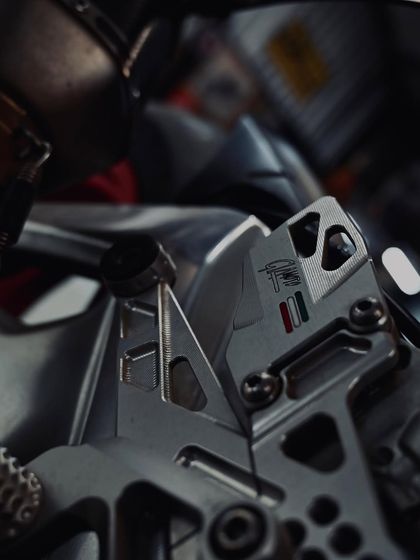 The beautifully machined rearsets on the Aprilia RSV4, offering adjustable ergonomics for the track.