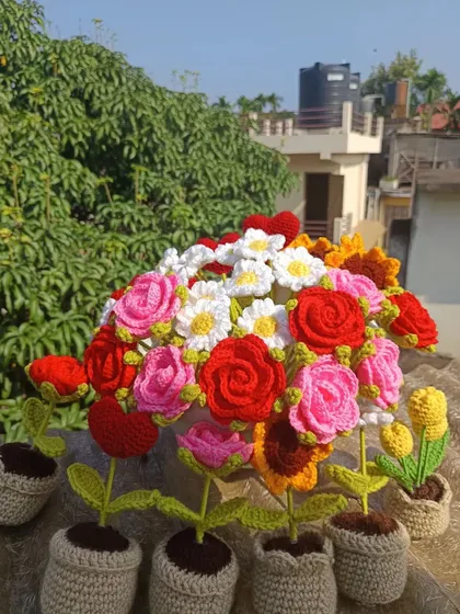 Another view of the mixed flower arrangement, showing how potted plants can be combined with bouquets.