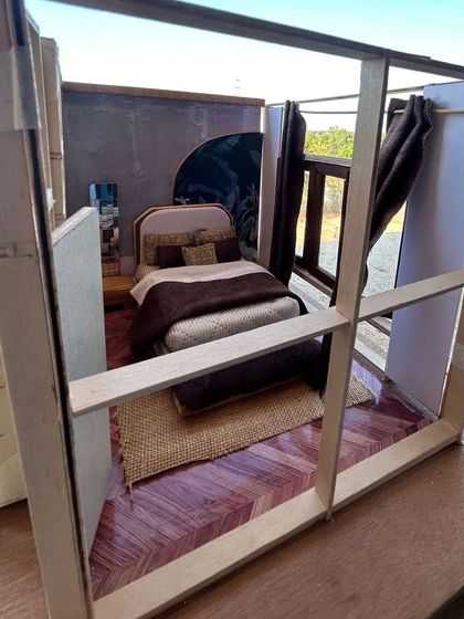 The full structure of the bedroom scale model. This view reveals the framework and construction, showing how the entire space is laid out.