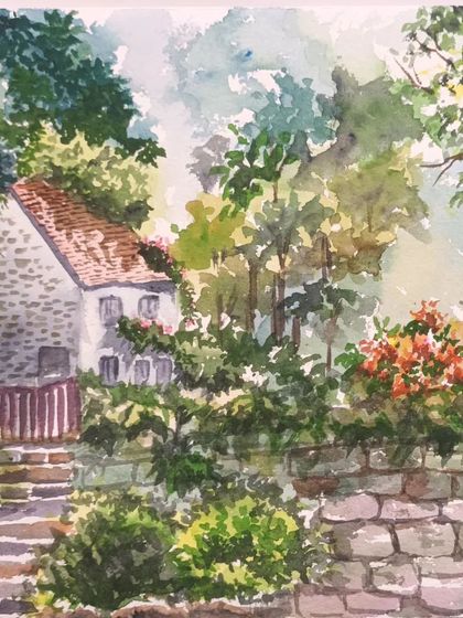 This watercolour painting of a country house surrounded by gardens is a great example of using colour and light to create a welcoming scene.