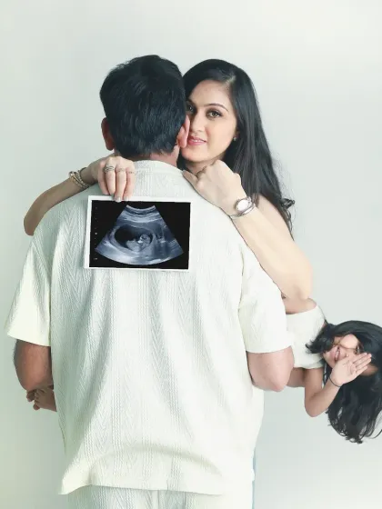Welcoming a new baby is a family affair. I love including older siblings in the shoot, capturing their excitement and creating a fun, playful memory like this one, with the first ultrasound picture taking center stage.
