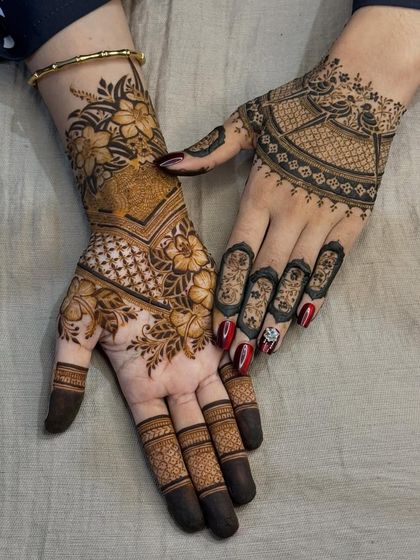 A beautiful combination of different traditional patterns, including floral motifs, checkerboard fills, and leafy vines. This shows how we can mix elements for a unique look.