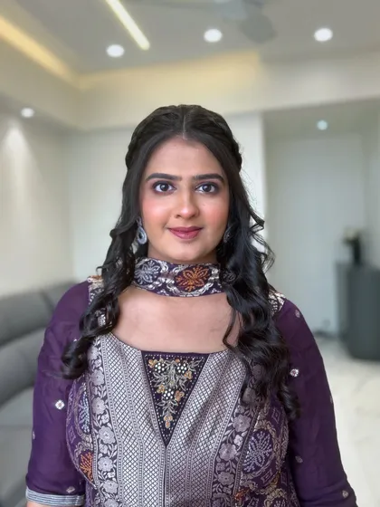 A soft and pretty look for this client. The makeup features a purple smokey eye that complements her traditional outfit.