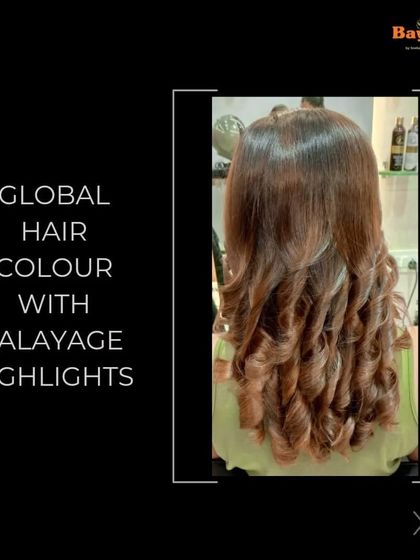 Another look at a global color combined with balayage highlights. The result is these perfectly formed, glossy curls where you can see the seamless blend of the base color and the lighter, hand-painted pieces.
