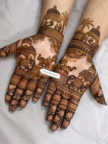A classic design with elephants and palace motifs, perfect for a traditional bride. The fingers are decorated with lotus patterns.