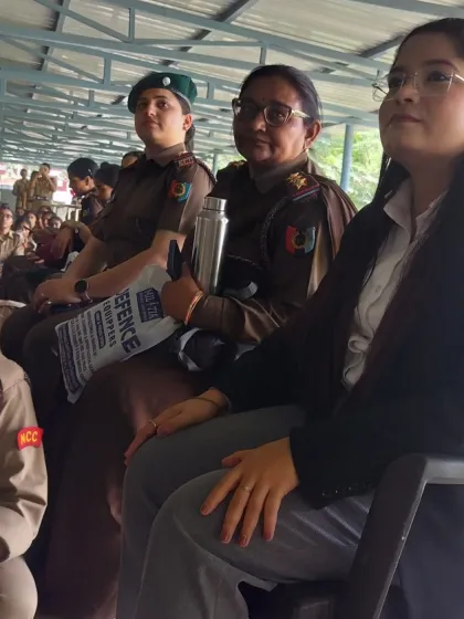 Seated in the audience with NCC officers during a lecture series.