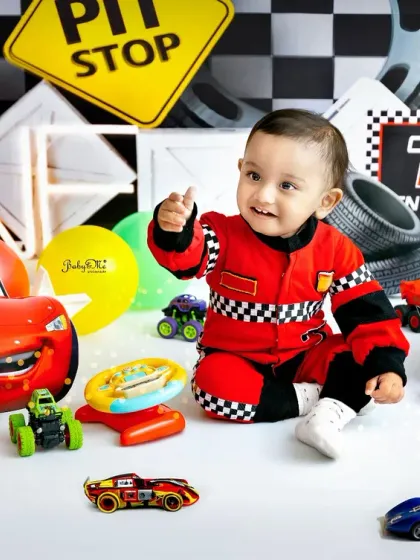 A happy racer playing with his toy cars. These candid moments of play result in the most genuine and heartwarming photographs.