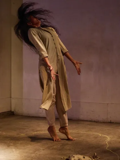 A full-body shot from "DANDYLION," where I use my physicality to convey the story of resilience. The performance was developed in Tokyo and is a piece I hope to bring to audiences in India.