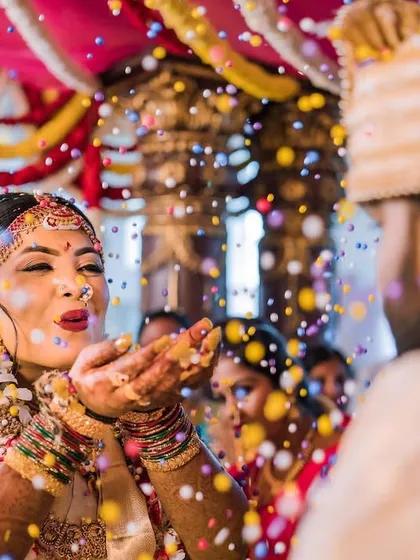 A fun and vibrant moment from the ceremony. My makeup stayed flawless through all the rituals and celebrations.