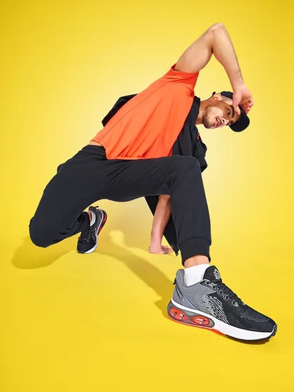 A high-energy shoe campaign requires dynamic poses and bold colors. I used a stark yellow background and a low-angle shot to make the sneakers the hero of the image, emphasizing their design and capturing a sense of movement and athletic style.