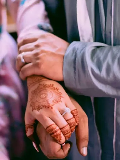 A beautiful, professionally shot photo showing the henna stain in a candid moment.