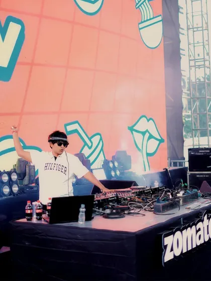 An action shot from my Zomaland set. Fist in the air, getting the crowd hyped. This is the energy I bring to every festival performance.