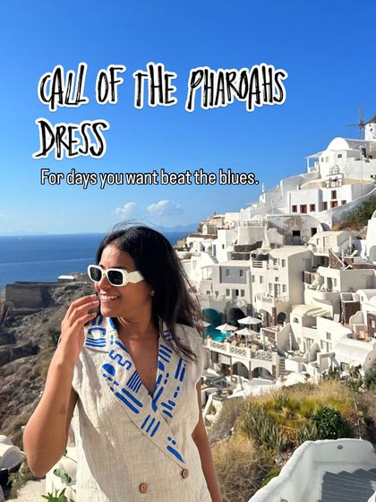 The Call of the Pharaohs dress, worn against the beautiful backdrop of Santorini. This linen blazer dress features a collar with my Egyptian-inspired artwork, perfect for beating the blues.