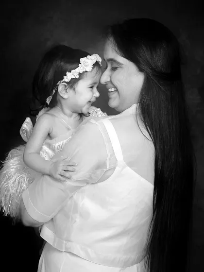The look of love between a mother and her child. This black and white candid shot is full of emotion and is a beautiful memory to cherish.