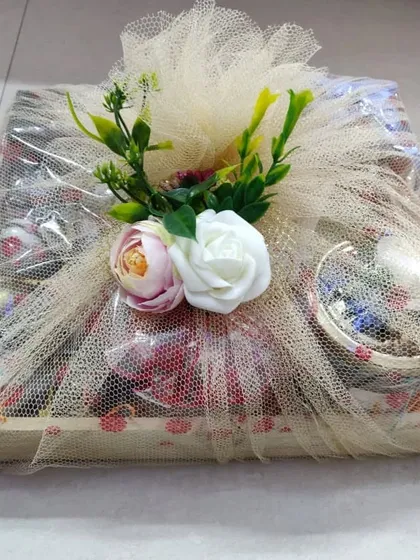 A fully wrapped wooden tray hamper, ready to be gifted.