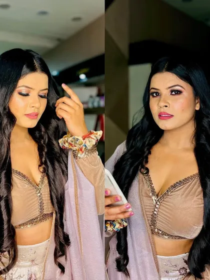 A glamorous party look with long, flowing waves. The client's makeup is soft and sultry, perfect for an evening party or a special date night.