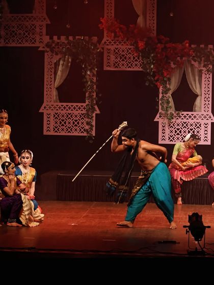 A full stage view of a dramatic scene from "UNMASKED". This image captures the interaction between multiple characters and the intricate set design that brings the story to life.