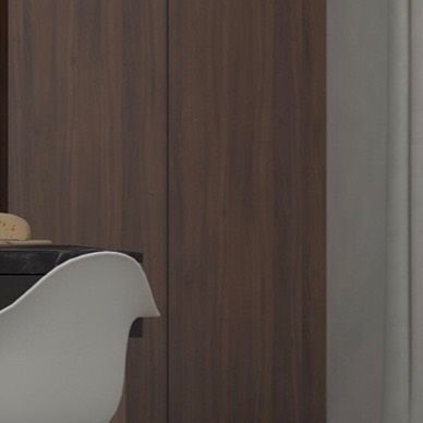 A close-up showing the contrast between the dark veneer and the white chair, highlighting the material palette.