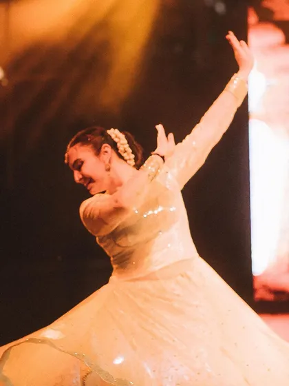 A close-up on a Kathak dancer's expressive movement, with her flowing dress creating a soft, glowing effect. I often use a shallow depth of field to isolate the artist and their emotion.