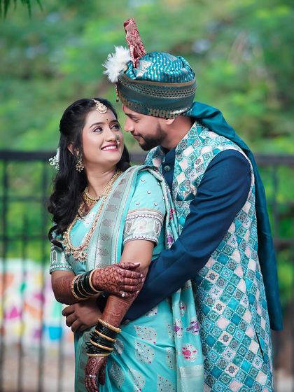 A sweet, intimate moment between the couple. The groom's patterned sherwani and the bride's light blue saree create a modern yet traditional look. I focus on capturing these gentle interactions that show your connection.