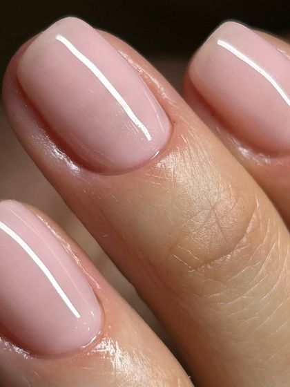A perfect sheer pink nude manicure. This is the ultimate 'clean girl' aesthetic, enhancing the natural nail with a healthy, polished glow.