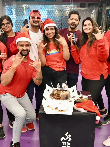 The whole gang after the cake cutting during our Christmas party. The Santa hats and big smiles say it all.