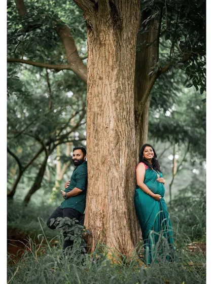 This image embodies our candid, nature-focused approach. We found a serene spot in a Bangalore forest, allowing the couple to relax and connect naturally, resulting in an authentic and peaceful maternity portrait.