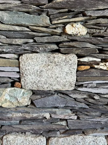 The natural texture of a stacked stone wall in Ladakh. Travel is a huge source of inspiration, and the raw, resilient architecture of the mountains often finds its way into our material explorations.