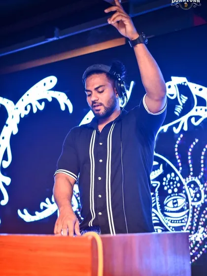 Take only memories, leave only footprints. A shot of me at the decks, with my hand in the air, feeling the music and sharing that feeling with everyone in the room.