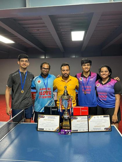Celebrating a team victory with coaches and players. Akash K J's splendid performance made him the unbeaten player of the tournament.