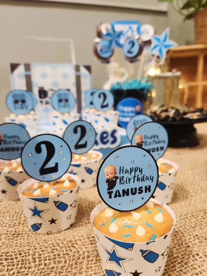 Personalized cupcakes for Tanush's second birthday, with cute Boss Baby toppers.
